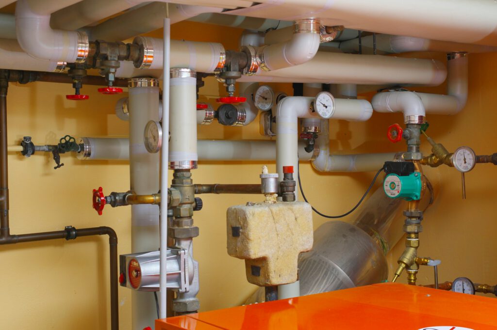 Boiler room pipework, valves and pressure gauges ready for an annual service